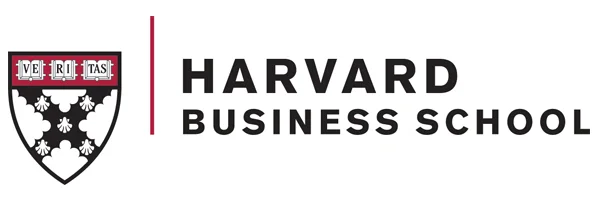 The logo of Harvard Business School, showcasing a traditional shield design with the institution's name prominently displayed.